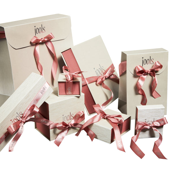 Jools branded gift boxes with pink ribbons