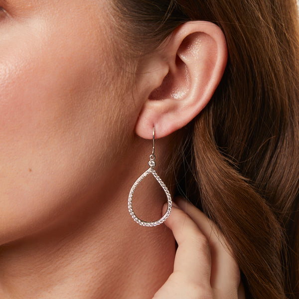 A pair of sterling silver teardrop earrings with fishhook fastening and cubic zirconia stones, rhodium finished for tarnish-free wear.