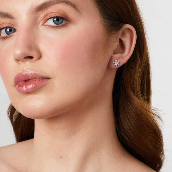 A pair of sterling silver snowflake earrings inset with cubic zirconia stones-JOOLS by Jenny Brown