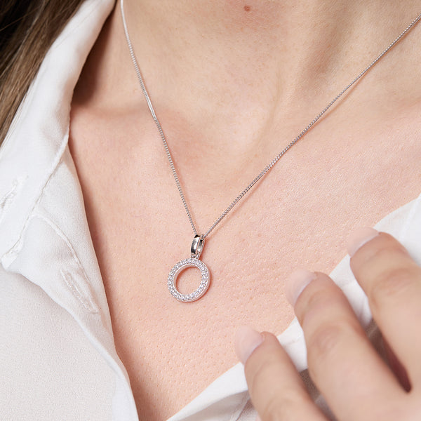 A sterling silver small open circle pendant set with pave cubic zirconia's on a chain,-JOOLS by Jenny Brown