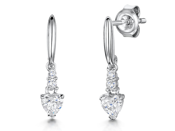 A pair of sterling silver solitaire heart drop earrings with a cubic zirconia stone, showing the earrings hanging vertically with light reflecting off the stones-JOOLS by Jenny Brown