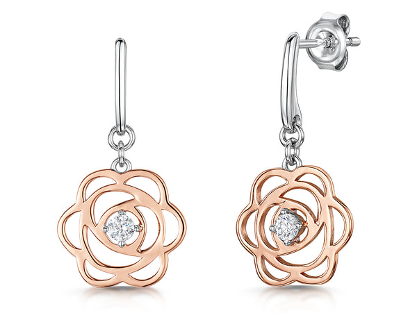 A pair of rose gold drop earrings featuring a rose petal design with a central cubic zirconia stone, accompanied by sterling silver details.