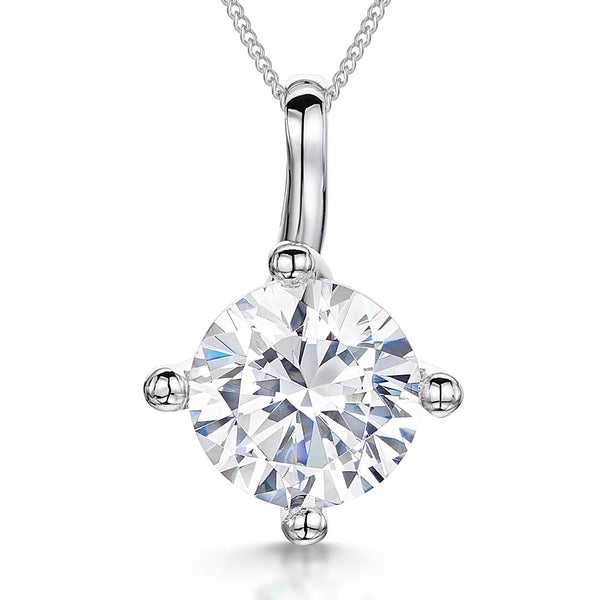 A sterling silver solitaire pendant featuring a 4 carat cubic zirconia, suspended from a silver chain.-JOOLS by Jenny Brown