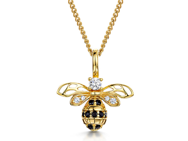 A yellow gold bee necklace with black and white cubic zirconia stones -JOOLS by Jenny Brown