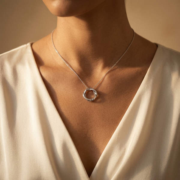Sterling Silver Twisted Woven Circle Pendant With Cubic Zirconias