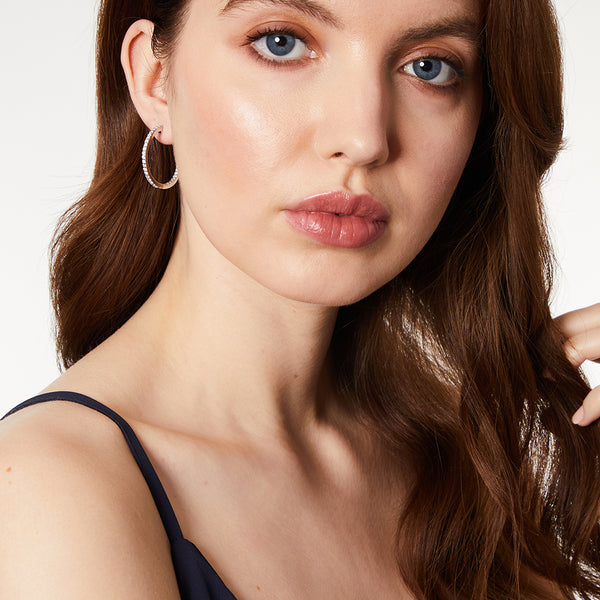 A pair of medium-sized sterling silver hoop earrings set with cubic zirconia's-JOOLS by Jenny Brown