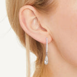 Load image into Gallery viewer, A pair of sterling silver long pave bar drop earrings with pear cut cubic zirconia stones- JOOLS By Jenny Brown
