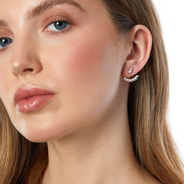 A pair of sterling silver jacket earrings featuring marquise cut cubic zirconia stones, with the earrings detachable at the base allowing one to wear as solitaire studs.