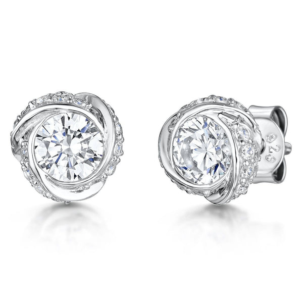 A pair of sterling silver swirl solitaire stud earrings with a clear central cubic zirconia stone surrounded by smaller clear stones - JOOLS By Jenny Brown
