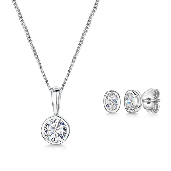 A set of sterling silver jewelry including an oval pendant necklace and round earrings, both adorned with cubic zirconia stones-JOOLS by Jenny Brown