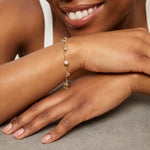 Load image into Gallery viewer, A yellow gold clover charm bracelet with  nine cubic zirconia stones -JOOLS by Jenny Brown
