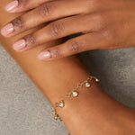 Load image into Gallery viewer, A yellow gold clover charm bracelet with  nine cubic zirconia stones -JOOLS by Jenny Brown
