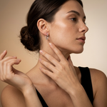 Load image into Gallery viewer, Model Wearing Dainty 925 sterling silver solid heart-shaped hoop earrings with snap bar back closures
