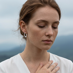 Load image into Gallery viewer, Model Wearing Dainty 925 sterling silver solid heart-shaped hoop earrings with snap bar back closures
