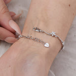 Load image into Gallery viewer, Sterling Silver Bracelet  Set With Alternating Flower and Single Stone Solitaire Cubic Zirconia Stones - JOOLS By Jenny Brown
