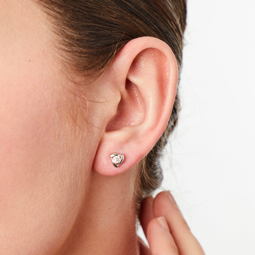 A pair of sterling silver triangle stud earrings with cubic zirconia, rhodium finished, with post and butterfly backing-JOOLS by Jenny Brown