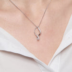 Load image into Gallery viewer, A sterling silver disc pendant set with cubic zirconia stones,-JOOLS by Jenny Brown
