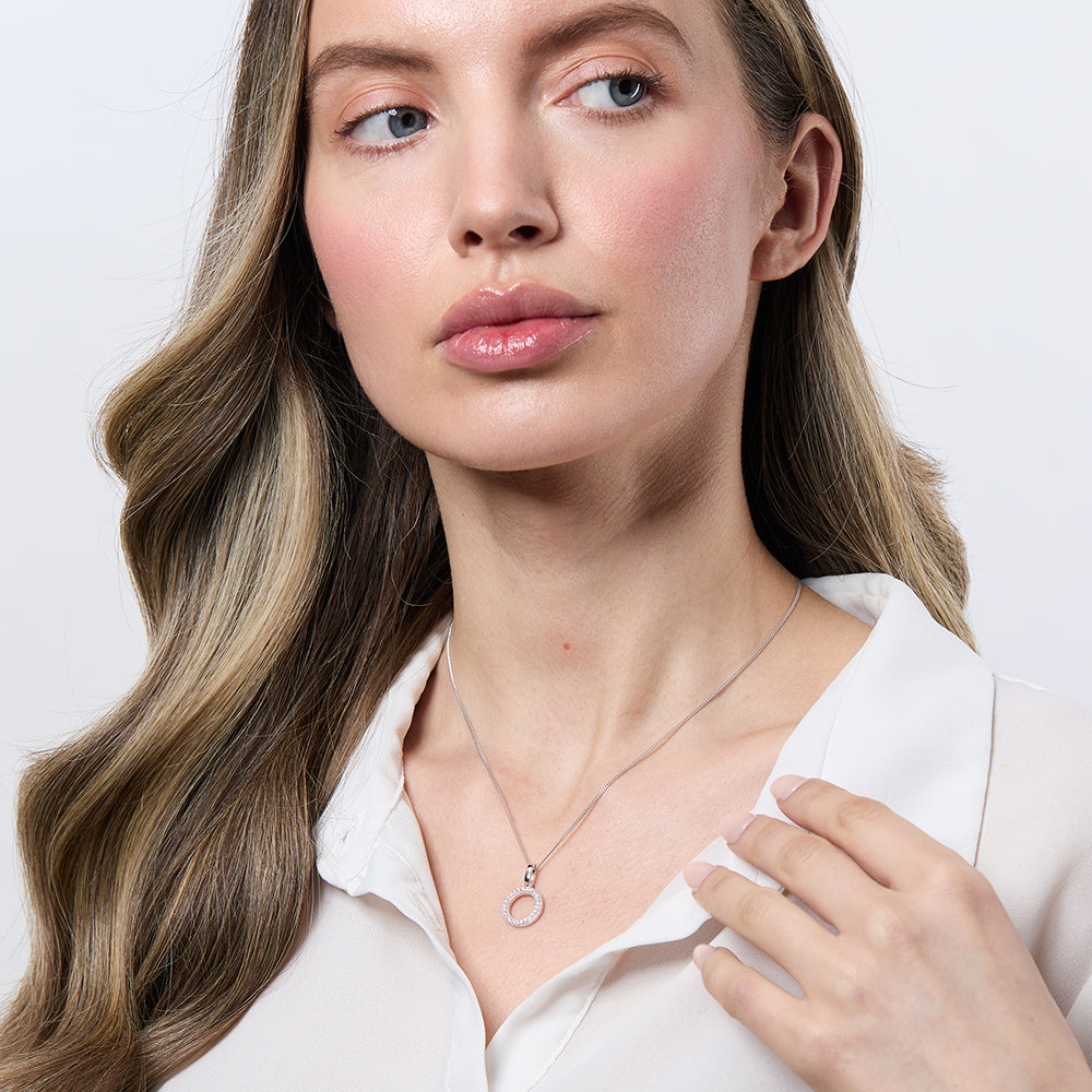 A sterling silver small open circle pendant set with pave cubic zirconia's on a chain,-JOOLS by Jenny Brown