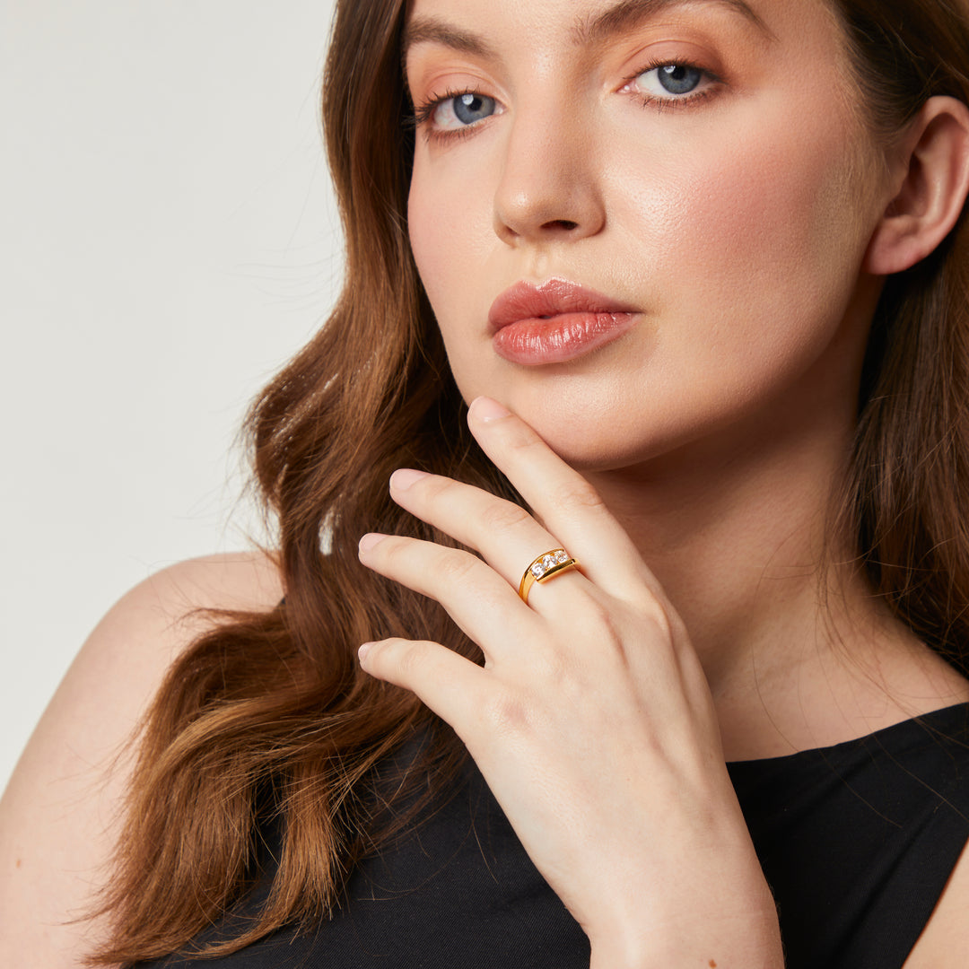 Gold ring featuring three sparkling diamonds set between two sleek, curved bands-JOOLS by Jenny Brown