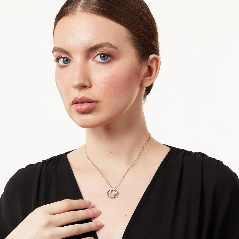 Sterling silver three circle pendant with cubic zirconia stones set in the inner circles, attached to a silver chain-JOOLS by Jenny Brown