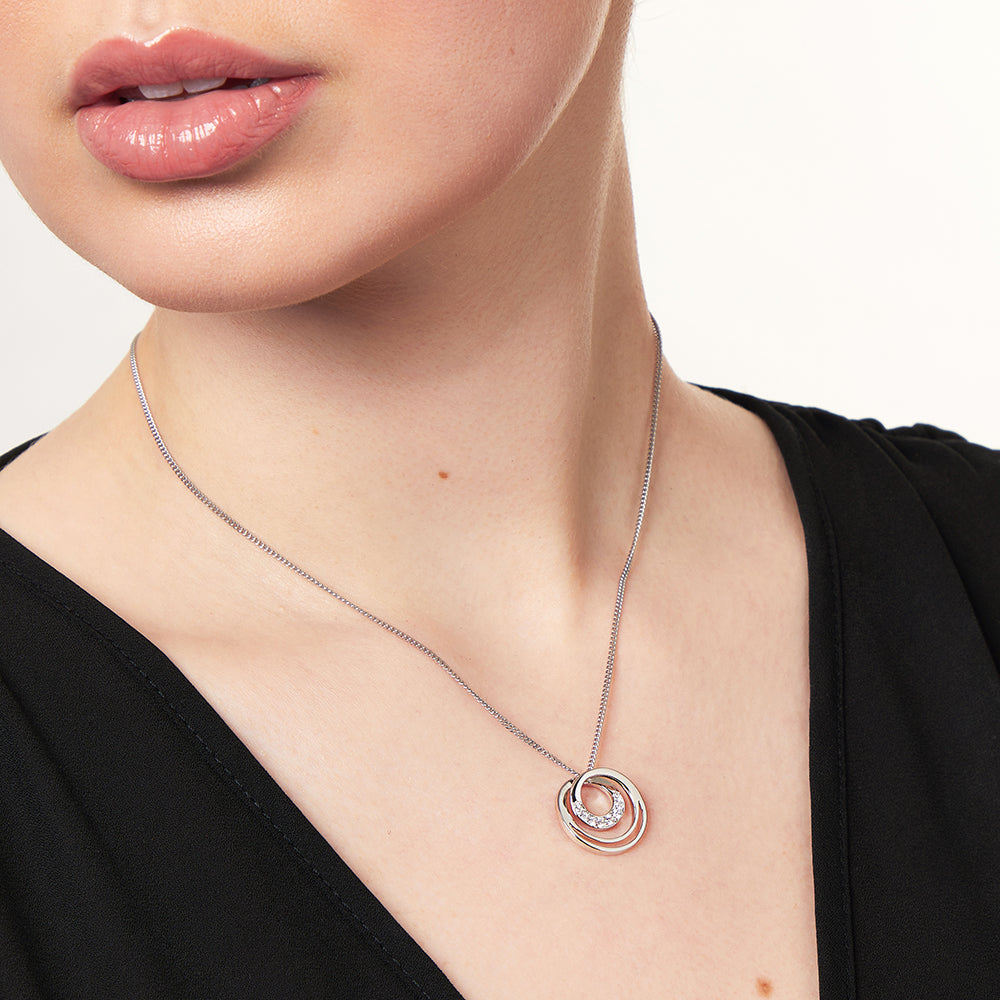 Sterling silver three circle pendant with cubic zirconia stones set in the inner circles, attached to a silver chain-JOOLS by Jenny Brown