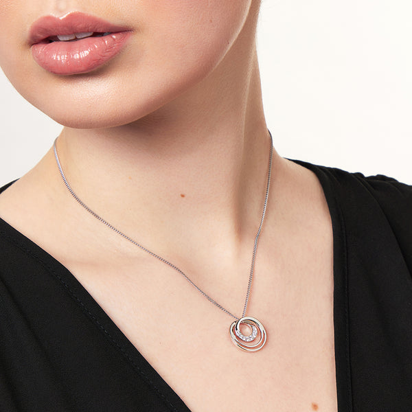 Sterling silver three circle pendant with cubic zirconia stones set in the inner circles, attached to a silver chain-JOOLS by Jenny Brown