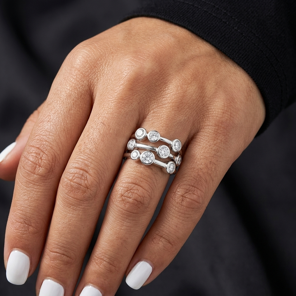 Solid 925 sterling silver statement ring featuring three rows of round white cubic zirconia stones in polished bubble bezel settings.