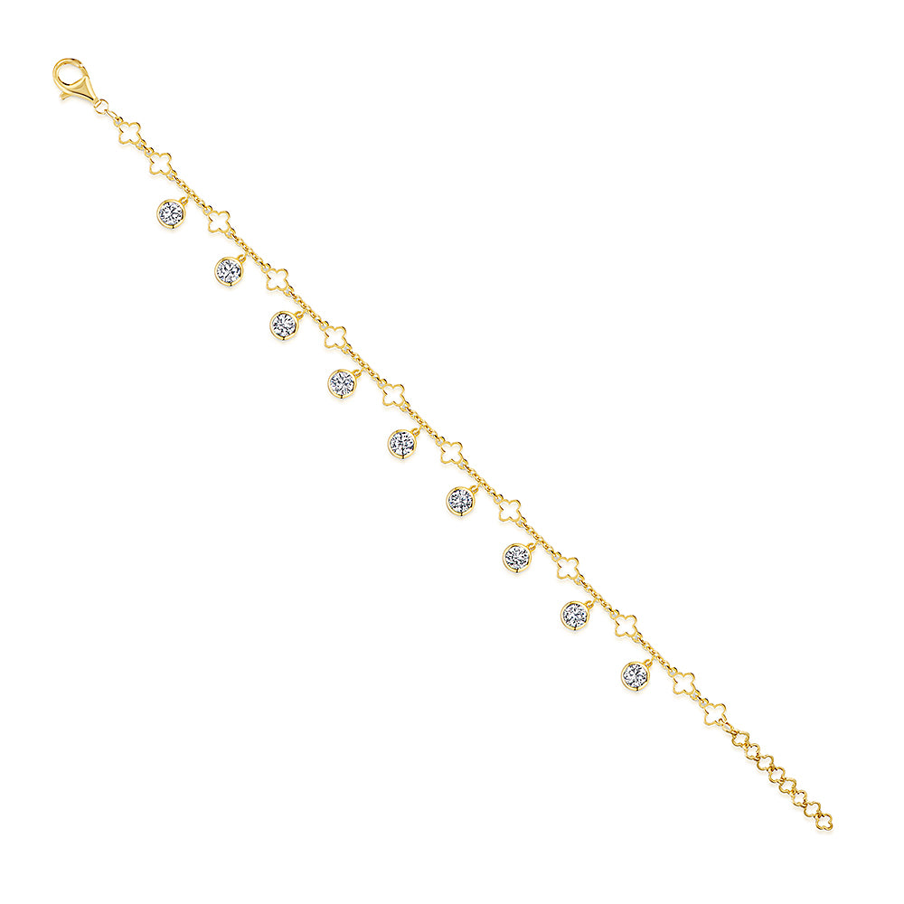 A yellow gold clover charm bracelet with  nine cubic zirconia stones -JOOLS by Jenny Brown