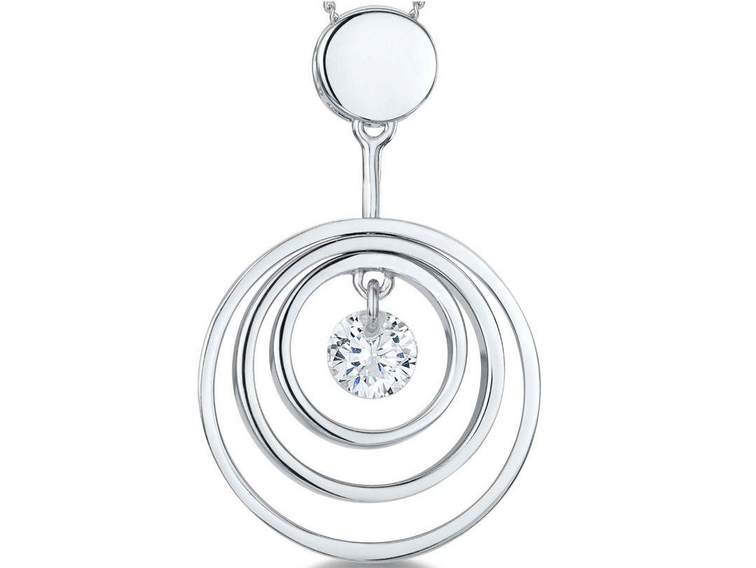 A sterling silver pendant with three silver rings and a suspended cubic zirconia center stone.-JOOLS by Jenny Brown