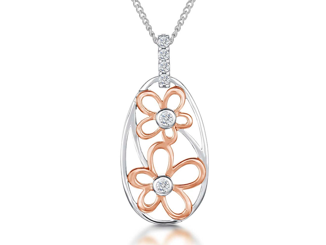 Sterling silver oval pendant with rose gold flowers and cubic zirconia stones, accompanied by a silver curb chain.