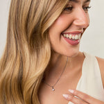 Load image into Gallery viewer, A sterling silver solitaire pendant with a round cubic zirconia stone on a silver chain-JOOLS by Jenny Brown
