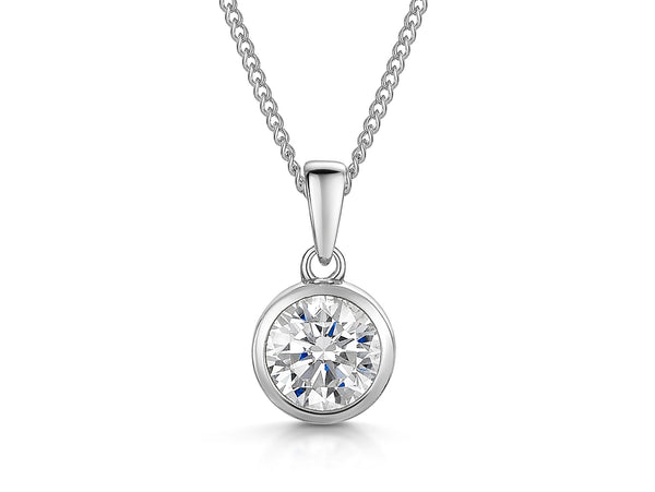 A sterling silver solitaire pendant with a round cubic zirconia stone set in a rub over setting-JOOLS by Jenny Brown