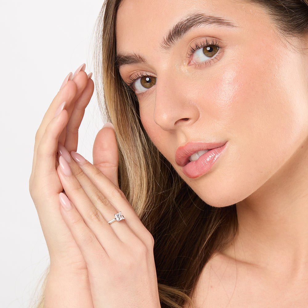 A sterling silver square solitaire ring with a princess cut 1 Carat cubic 