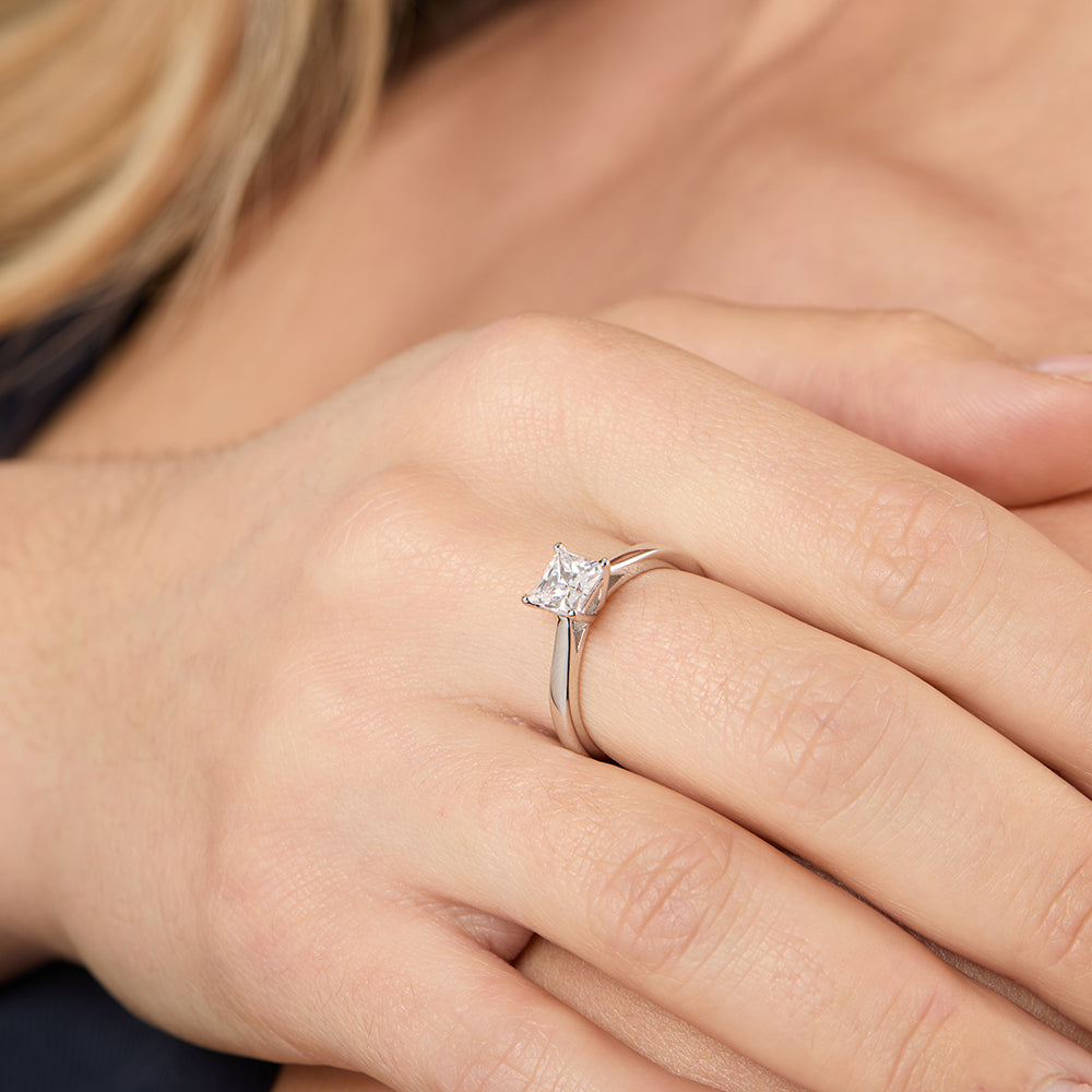 A sterling silver square solitaire ring with a princess cut 1 Carat cubic 