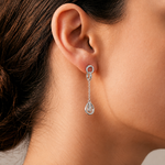 Load image into Gallery viewer, model waering Art Deco-style sterling silver drop earrings featuring a sparkling oval AAA cubic zirconia center
