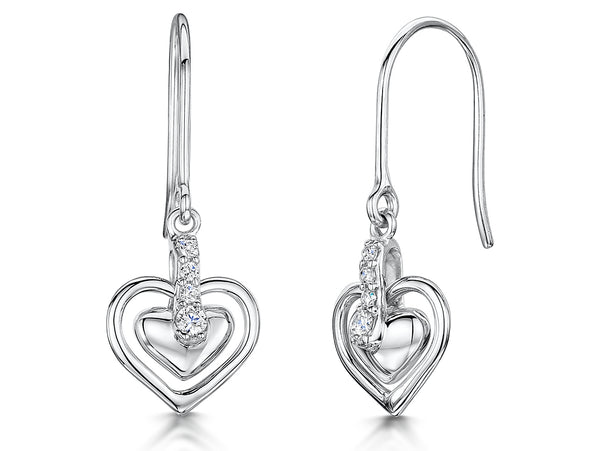 A pair of sterling silver heart-shaped drop earrings with a cubic zirconia in the center, dangle style.- JOOLS by Jenny Brown