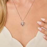 Load image into Gallery viewer, Sterling silver necklace with a double floating hearts design featuring cubic zirconia stones, rhodium finished for tarnish-free wear, comes with a 16-18 inch adjustable chain.-JOOLS by Jenny Brown
