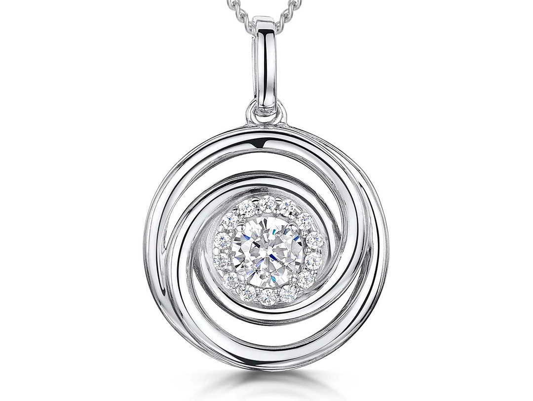 A sterling silver circle swirl pendant with a halo setting of cubic zirconia stones, displayed on a silver chain-JOOLS by Jenny Brown