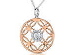 Load image into Gallery viewer, Rose gold pendant with an intricate open circle pattern and a central cubic zirconia, accompanied by a silver curb chain.
