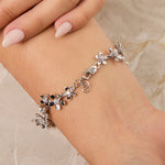 Load image into Gallery viewer, silver bracelet with floral designs set with cubic zirconia stones- JOOLS by Jenny Brown
