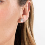 Load image into Gallery viewer, A pair of sterling silver swirl solitaire stud earrings with a clear central cubic zirconia stone surrounded by smaller clear stones - JOOLS By Jenny Brown
