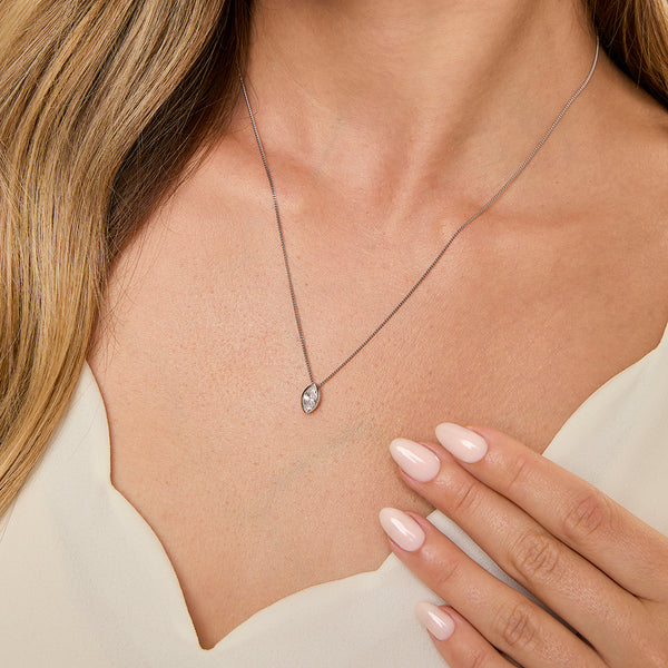 Sterling silver petite pendant with a marquise rubover set cubic zirconia, accompanied by a 16-18 inch adjustable chain -JOOLS by Jenny Brown