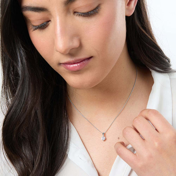 A sterling silver solitaire pendant with a 6mm brilliant cut cubic zirconia, featuring a plain silver bale and an adjustable chain-JOOLS by Jenny Brown