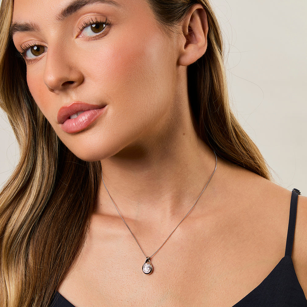 A sterling silver oval teardrop pendant necklace with a solitaire cubic zirconia stone-JOOLS by Jenny Brown