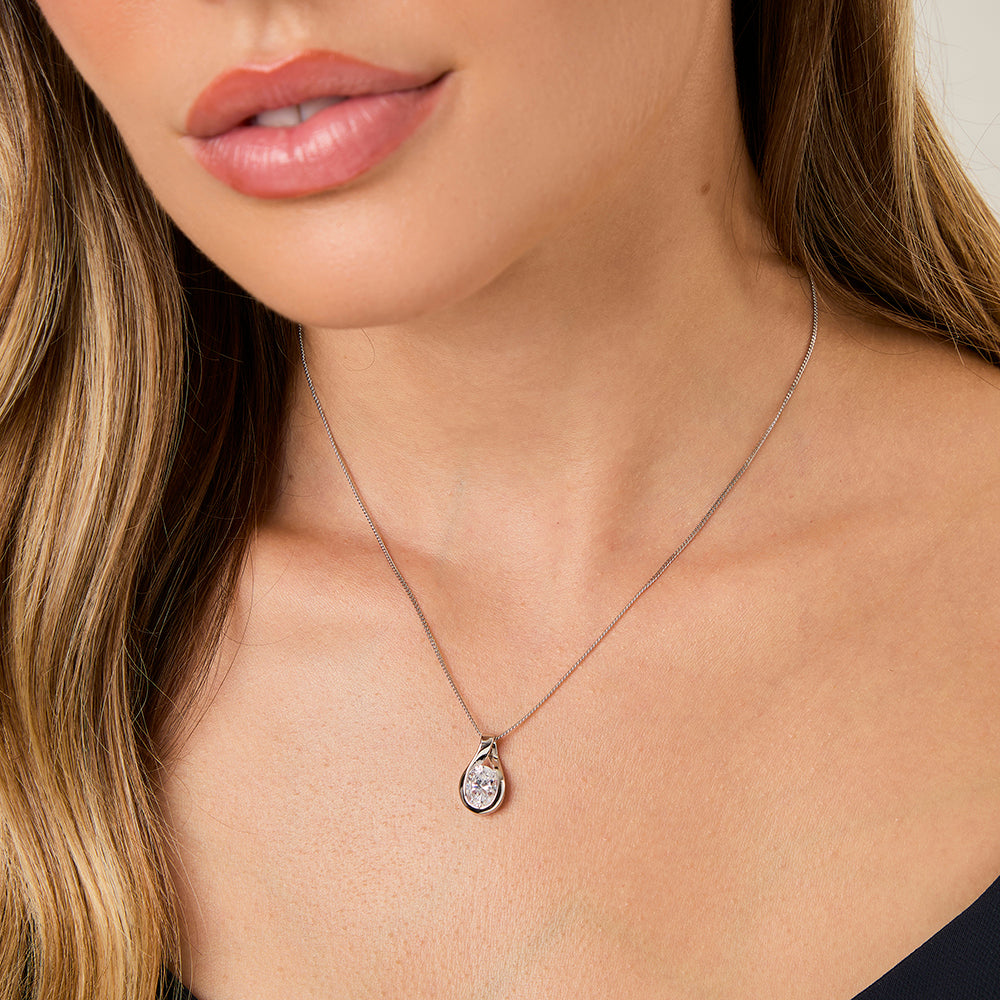 A sterling silver oval teardrop pendant necklace with a solitaire cubic zirconia stone-JOOLS by Jenny Brown