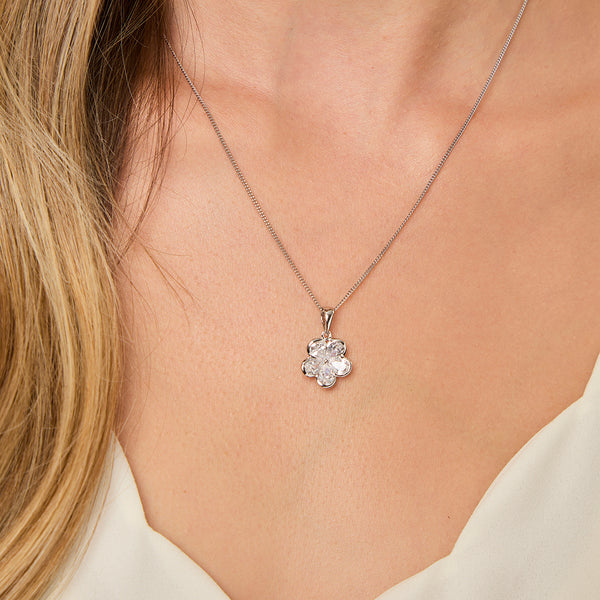 A sterling silver flower pendant with five cubic zirconia petals-JOOLS by Jenny Brown