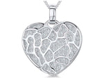 Load image into Gallery viewer, A sterling silver heart-shaped pendant covered in sparkling white cubic zirconia stones.-JOOLS by Jenny Brown
