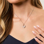 Load image into Gallery viewer, A sterling silver pendant featuring angel wings surrounding a heart-shaped pave with cubic zirconia  stones- JOOLS by Jenny Brown
