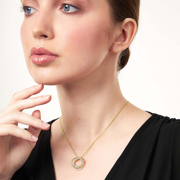Gold necklace with a circular pendant featuring cubic zirconia - JOOLS by Jenny Brown