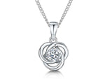 Load image into Gallery viewer, A sterling silver pendant with interlinked circles and a central cubic zirconia, attached to a chain.
